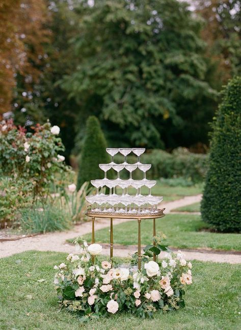 natalie-ryan-wedding-champagne-0222 Champagne Tower With Flowers, Champagne Tower Table Wedding, Champagne Towers Wedding, Coupe Champagne Tower, Chateau Wedding Decor, Small Champagne Tower Wedding, Wedding Welcome Sign Champagne, French Garden Wedding, Champagne Tower At Wedding