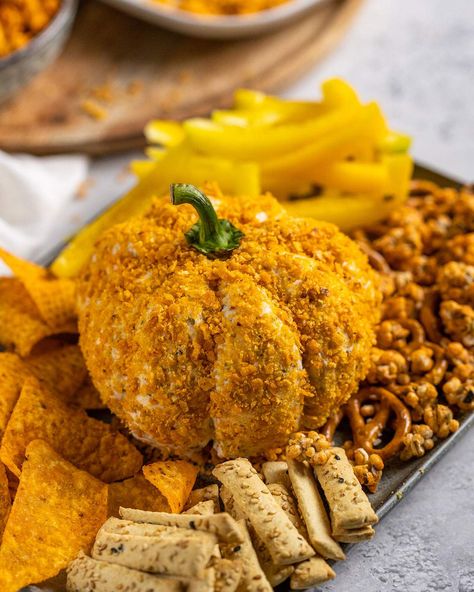 This Pumpkin Cheese Ball is a super fun appetizer to create in fall! It is made of a pumpkin-shaped cheese ball that is created with cream cheese and ranch seasonings, coated in a layer of spicy tortilla chip crumbles. #pumpkin #fallrecipes #appetizer Halloween Cheese Ball, Pumpkin Cheese Ball, Vegan Cauliflower Wings, Vegan Finger Foods, Decorative Food, Cream Cheese Ball, Tortilla Chip, Halloween Food Appetizers, Ball Recipes