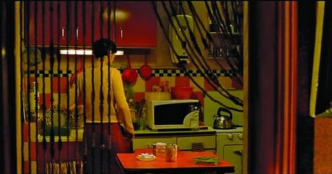 Amelie Apartment, Amelie Aesthetic, Movie Rooms, Clue Movie, Red Cabinets, Bead Curtain, Colorful Apartment, Set Decoration, Retro Room