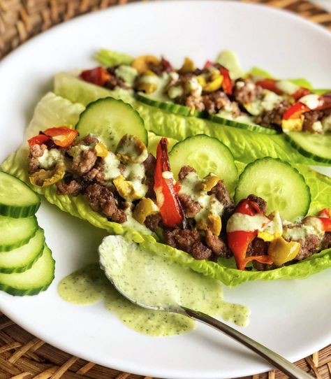 I got another healthy recipe for you guys that can be made in under 30 minutes. Lettuce has become the new bread for low carb options and you know what? It is a great vehicle to make for a delicious bite. Servings: about 6 tacos Total Time: approx. 30 min Ingredients 1 lb of ground… Read More Mediterranean Ground Beef Lettuce Taco Mediterranean Ground Beef, Kitchen Mediterranean, Low Carb Options, Lettuce Boat, Lettuce Tacos, Dairy Free Pasta, Fresh Olives, Healthy Chicken Salad, Herb Sauce