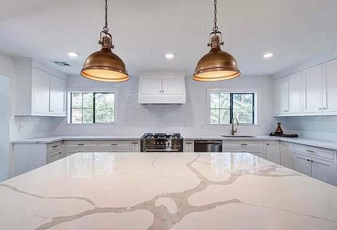 Kitchen with calacatta countertops, island, white cabinets and gold pendant lights Calacatta Alabaster Quartz, Calcutta Sol Quartz Countertops, Calcutta Classic Quartz Countertop, Calcutta Ultra Quartz Kitchen, Calacatta Elysio Quartz, Calcutta Idillio Quartz, Calacatta Idillio Quartz Kitchen, Calacatta Idillio Quartz, Calcatta Quartz Countertop