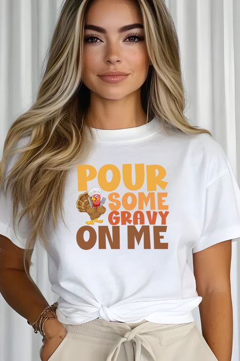 If you're all about that gravy life, this "Pour Some Gravy On Me" Thanksgiving shirt is the perfect way to show your love for the ultimate holiday sauce! Featuring a bold turkey leg design, this tee adds the perfect touch of humor to your Thanksgiving feast. Whether you're drowning your mashed potatoes or pouring gravy on everything in sight, this shirt is sure to make your family and friends chuckle. Thanksgiving Tshirt Ideas, Holiday Sauce, Friendsgiving Feast, Turkey Leg, Funny Thanksgiving Shirts, Turkey Legs, Lover Sweatshirt, Thanksgiving Feast, Thanksgiving Shirt