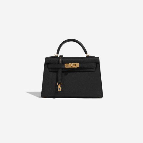 This tiny Kelly, in the Sellier style, is in black epsom leather with gold hardware and has tonal stitching, two front straps with front toggle closure, single rolled handle and removable shoulder strap.

The interior is lined with black leather and has one open pocket on the back wall. Hermes Mini Kelly Black, Chanel Models, Lisa Closet, Hermes Collection, Monaco Gp, Mini Kelly, Hermes Kelly Bag, Latest Bags, Kelly Bag