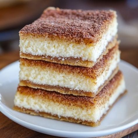 Super Easy Churro Cheesecake Bars Recipe Churros Cheesecake Bars, Mexican Birthday Dessert, Dessert For Taco Bar Party, Dessert With Mexican Food, Margarita Bars Dessert, Mexican Potluck Ideas Desserts, Churro Dessert Ideas, Easy Mexican Dessert, Taco Night Dessert