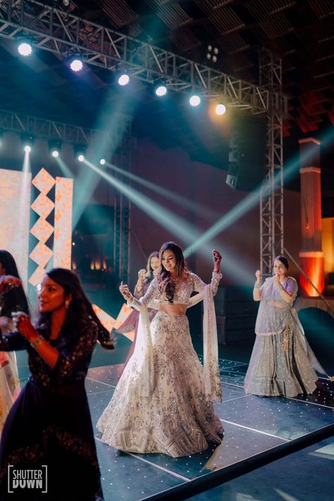 Photo of The bride dancing with her bridesmaids on sangeet Sangeet Songs, Engagement Portraits Poses, Indian Wedding Aesthetic, Bride And Bridesmaid Pictures, Ladies Sangeet, Sangeet Outfit, Lehenga Jewellery, Wedding Portrait Poses, Desi Wedding Decor