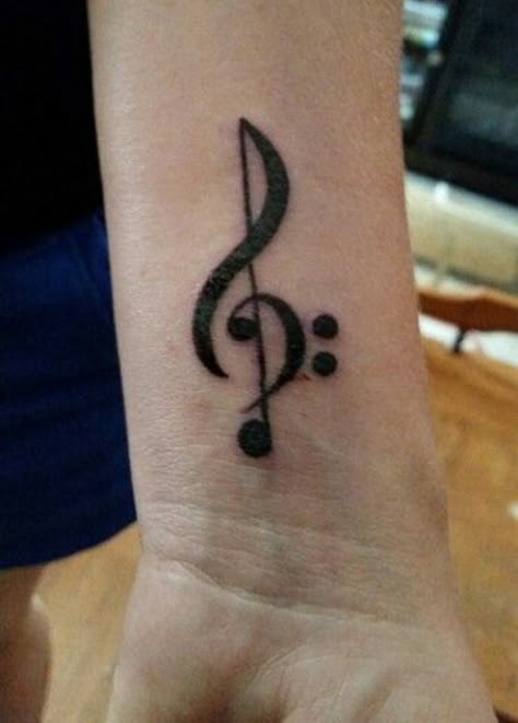 One example of a beautiful tattoo that depicts one’s love for music is the treble clef tattoo. The treble clef refers to the musical symbol that is used by musicians in the form of notations. Treble Clef And Bass Clef Tattoo, Treble Clef Bass Clef Tattoo, Treble And Bass Clef Tattoo, Music Note Semi-colon Tattoo, Music Symbol Tattoo, Clef Tattoo, Semicolon Tattoo Meaning, Treble Clef Tattoo, Cactus Tattoos