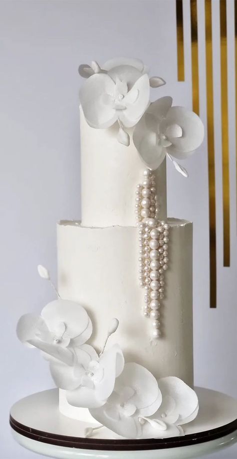 45 Inspiring Wedding Cake Designs For Your Big Day : Elegant Orchid & Pearl Cake Minimalist, 2024 Cake Trends, Wedding Cake With Pearls, Pearl Detail Wedding Cake, White Cake With Orchids, Simple White Wedding Cake Pearls, Wedding Cake Orchid Flowers, Wedding Cake Orchids White, Fruit Wedding Cake