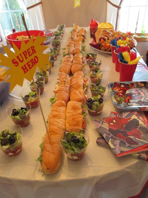 "Super Hero" sandwiches and layered taco cups.  Fresh fruit in waffle cones.  Super Hero Baby Shower. Superhero Food Ideas Super Hero Parties, Super Hero Birthday Party Ideas Food, Superhero Sandwiches, Super Hero Baby Shower Ideas, Marvel Baby Shower Ideas, Super Hero Party Food, Superhero Baby Shower Ideas, Super Hero Food, Super Hero Baby Shower