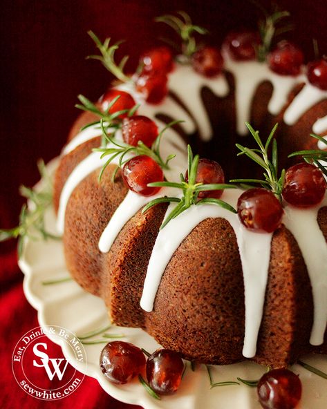 close up of a christmas bundt cake with white icing drizzle down decorated with rosemary sprigs and cherries Black Forest Bundt Cake, Wreath Bundt Cake, Cherry Bundt Cake, Fruit Kabob, Christmas Bundt Cake, Mom Meals, Mince Pies Christmas, Easy Cakes, Cranberry Cake