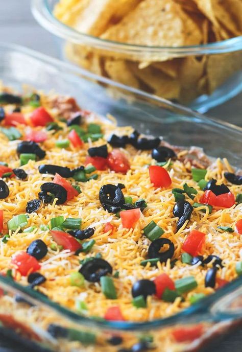 The BEST Tex-Mex 7 Layer Bean Dip | The Kitchen Magpie 7 Layer Mexican Dip, Recipe With Black Beans, Layer Dip Recipe, 7 Layer Bean Dip, Mexican Dip Recipes, 7 Layer Dip Recipe, Mexican Layer Dip, Mexican Dip, Layered Dip Recipes