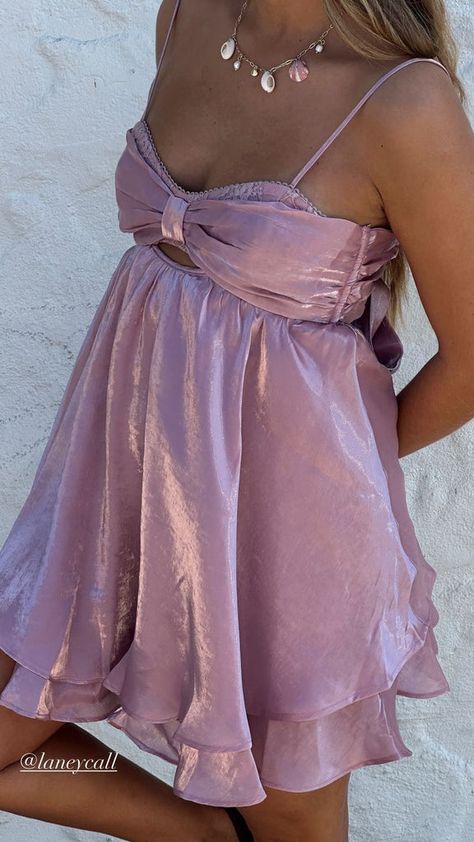 "Flaunt your style with this stunning satin mini dress, perfect for date nights, summer outings, and special occasions. The soft lilac hue and delicate fabric give off a romantic and luxurious feel, while the bow detail adds a touch of elegance. Pair with your favorite accessories for a complete look.✨"   #LilacDress #SatinDress #SummerStyle #MiniDress #DateNightOutfit #HOCO #Homecoming Dress Sweethearts Dance Dresses, Spring Prom Satin Mini Dress, Chic Flowy Pink Mini Dress, Hocoming Dresses, Formal Dresses Mini, Mini Formal Dresses, Soft Summer Outfits, Pink Feminine Satin Mini Dress, Valentines Dresses