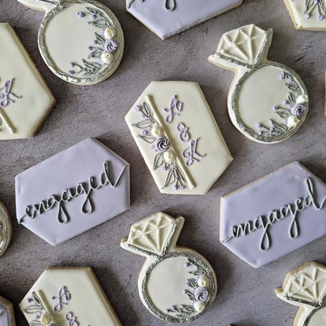 Lovely lavender and silver engagement set. So elegant for your celebration! #petitesweetsbydonna #engaged #engaged2024 #engagedlife #lavender #cookie #cookies #cookiesoffacebook #cookiesofinstagram Engagement Sugar Cookies, Lavender Cookie, Lavender Engagement, Lavender Cookies, Engagement Cookies, Purple Bridal Shower, Engagement Humor, Bridal Shower Cookies, Lovely Lavender