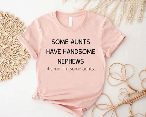 Auntie Shirt, Some Aunts Have Handsome Nephews Shirt, Aunt Gift From Nephew, Aunt Birthday Gift, Aunt Life Shirt, Aunt Sayings Shirt Gift 🎈HOW TO ORDER 1-) Please, check and review all the photos. 2-) Choose your t-shirt size and color. *Different styles of shirts may have different shades of same color choice due to different manufacturer brands. *For this reason, we recommend you to match shirts from the same styles if you want precisely matching colors (ex. Unisex, V-necks, Toddler, etc.). 3 Funny Aunt Onesie, Auntie Things, Nephew Shirts, Aunt Onesie, Auntie Era, Auntie Baby, Godmother Shirts, Aunt Birthday Gift, Aunt Sayings