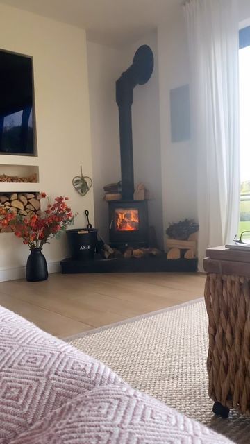 Log Burner Living Room Corner, Corner Wood Stove With Tv, Log Burner New Build House, Corner Log Burner Ideas Living Room, Wood Stove And Tv Placement, Corner Log Burner Living Rooms, Corner Stove Living Room, Log Burner Corner Of Room, Corner Woodstove Living Room