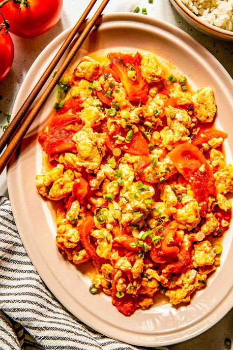 Fast, easy, and inexpensive, this vegetarian Chinese tomato and egg stir fry is a side dish you'll find often on Chinese and Taiwanese dinner tables. Chinese Eggs, Egg Stir Fry, Tomato And Egg, Fried Tomatoes, Healthy Meal Plan, Table For Two, Dairy Free Eggs, Salad Side Dishes, Healthy Meal Plans