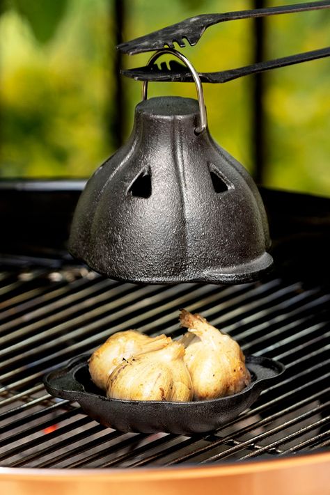 Roast bulbs of garlic on the grill or in the oven inside this Cast Iron Garlic Roaster to tame its harsh bite for a more sweet, savory, and spreadable flavor. Garlic Roaster, Fancy Kitchen, White Elephant Gift Ideas, Elephant Gift Ideas, Roasted Garlic Cloves, Best White Elephant Gifts, Fancy Kitchens, Uncommon Goods, Quick Weeknight Meals