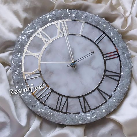 Ice white marble themed wall clock! . . 12" Dimensions . . . #resinified #clock #marble #icewhite #whitemarble #roman #silver #pakistan #handmadebusiness #diy #handmade #digitalart #time #resinepoxy #resin #art #artlovers #aesthetic #modern #goodvibes Resin Art Wall Clock Design, Resin Wall Clock Design, Simple Resin Clock, Resin Clock Marble Effect, Resin Clock Square, 12 Dimensions, Handmade Business, Diy Handmade, White Marble