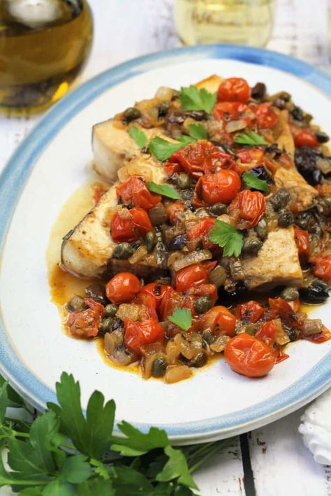 Sicilian swordfish with tomatoes, capers and olives: a combination of commonly used Sicilian ingredients to create this elegant one-pan meal that's ready in under 30 minutes. Swordfish Steak, Swordfish Recipes, Cherry Tomato Sauce, Seafood Entrees, Fresh Cherries, Seafood Restaurant, Fish Dishes, Fish And Seafood, Fish Recipes