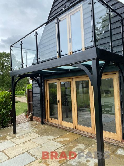 Stunning bespoke balcony with four support legs, mild steel and glass balustrade, complete with glass floor to let light floor through below by Bradfabs Ltd Metal Balcony, Steel Balcony, Balcony Exterior, Balcony Glass Design, Exterior Balcony, Glass Balcony, House Balcony, Paint Metal, Balcony Railing Design