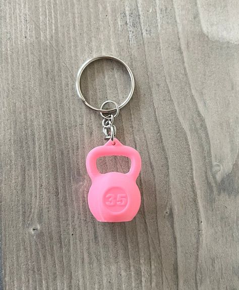 These mini kettlebell keychains are perfect if you are a fitness lover or enjoy strength training and exercise! They are also a thoughtful gift for someone you know who has a passion for health and fitness. This 3D printed kettlebell keychain is scaled down from a 35 lb weight. It is 1 inches in wide. The total height (which includes the keychain ring, chain, and kettlebell) is 2.5 inches. We also have dumbbell keychains in our shop if you are interested in those. https://www.etsy.com/listing/1426917300/dumbbell-keychain-perfect-for-weight?click_key=b218afea0a7c0afbeefbe2b729637b3bf6401f80%3A1426917300&click_sum=abbdf986&ref=shop_home_recs_8&sts=1 Please message us with any questions you may have!! Thanks so much for shopping our small business!! Mini Keychain, Cute Pink Keychain, Fun Pink Keychain For Gifts, 3d Printed Gifts, 3d Printed Keychain, 3d Print Keychain, Athletic Keychain, Novelty Pink Keychain For Gift, Clay Food Keychain