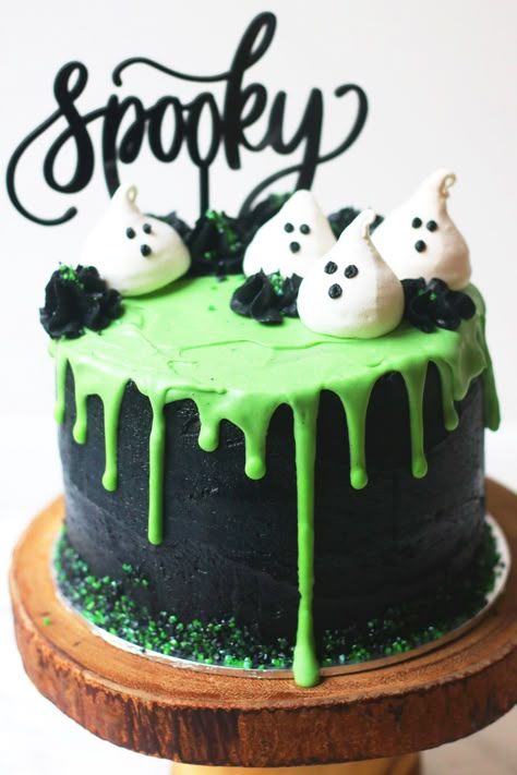 Halloween layer cake: Coconut and Lime Slime Cake. Decorated with black buttercream and green white chocolate ganache drip and coconut meringue ghosts. White Chocolate Ganache Drip, Meringue Ghosts, Slime Cake, Coconut Meringue, Black Buttercream, Chocolate Ganache Drip, Green Icing, Halloween Torte, Pasteles Halloween