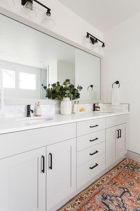 Bathroom cabinet Light grey cabinet are complemented by durable white quartz countertop and black pulls #bathroom #cabinet #bathroomcabinet #Lightgreycabinet #whitequartz #countertop #blackpulls Light Grey Cabinets Black Hardware, Mindful Gray Bathroom Vanity, Grey White Bathroom Ideas Decor, Light Grey Kitchen Cabinets Black Pulls, Double Vanity Bathroom One Mirror, Double Vanity One Mirror Two Lights, Bathroom White Cabinets Black Hardware, Double Vanity With One Mirror, White Cabinets Black Hardware Bathroom