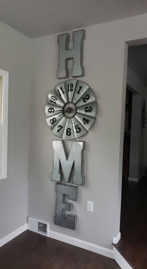 Decorating Around Large Clock Wall Ideas, Galvanized Letters Decor Ideas, Windmill Wall Decor Ideas, Large Farmhouse Clock On Wall, Large Rustic Wall Decor, Clock Wall Decor Ideas, Old Windmill Blades Wall Decor, Windmill Clock Wall Decor, Farmhouse Clocks Large