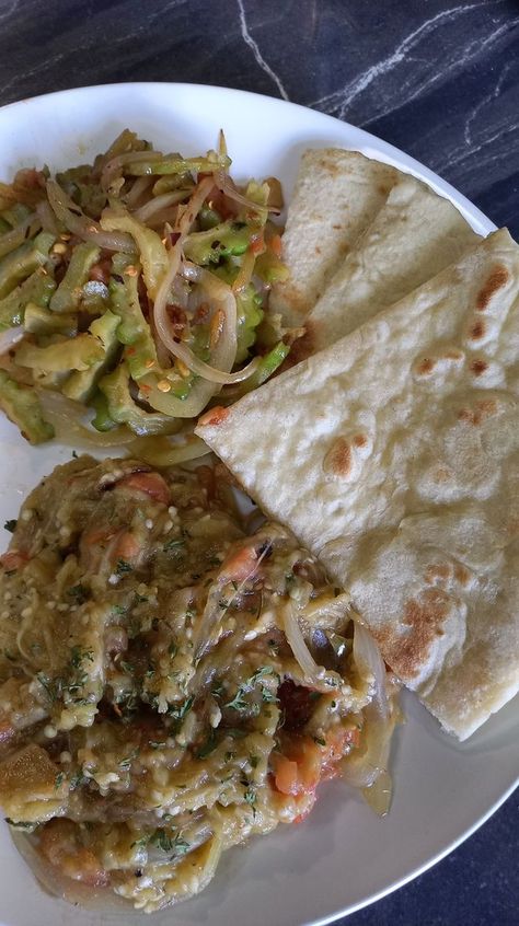 Let's make a traditional breakfast 😋 for my family 👪 Sada Roti, CARILLE and BAIGAN CHOKA. | Traditionally, sada Roti is made with baking powder and not yeast. Sada ROTI 4 cups flour 4 tsp baking powder 1 tsp salt 1tbsp sugar optional 1 3/4... | By Mama Mika's world | Facebook Trinidad Dishes, Baigan Choka, Traditional Breakfast, Trinidad, Yeast, Baking Powder, My Family, Flour, Salt