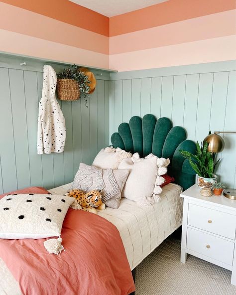 This girl's bedroom boasts a green scalloped upholstered headboard outfitted in pink bedding. A white nightstand is perched next to the bed in front of a light teal shiplap half wall. Modern Farmhouse Girls Bedroom, Fireplace Mount, Girls Bedroom Green, Green Girls Rooms, Peach Bedroom, Girls Boho Bedroom, Coral Bedroom, Room 2023, Teal Bedroom