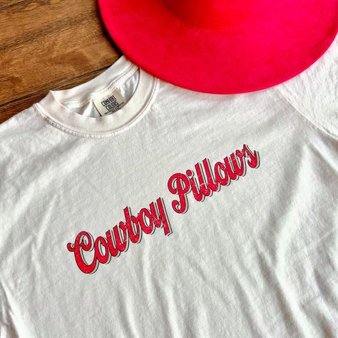 let your cowboy lay his head on your pillows today with our newest tee ❣️ match with a black maxi skirt or your favorite pair of jeans for the perfect western vintage look. shop now with our website in the link! #smallbusiness #cowboy Cowboy Pillows Shirt, Cowboy Pillows, Cowboy Pillow, Western Vintage, Black Maxi Skirt, Red Hat, Comfort Color, Black Maxi, Red Hats