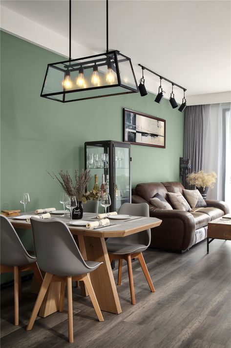 Grey Tulip Chairs With Wooden Legs are harmonious collocation with the light olive green background wall. Olive Living Rooms, Grey Flooring Living Room, Green Walls Living Room, Green Wall Color, Light Green Walls, Green Accent Walls, Green Dining Room, Sage Green Walls, Color Decor