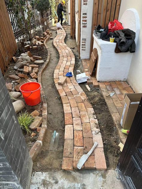 This brick pathway choose TAITONE reclaimed firebrick as walkway pavers! Bring natural imperfections with the weathered textures and rich colors. #firebrick #brickpathway #brickwalkway #brickpavers #taitonebrick Herringbone Brick Pathway, Red Brick Pathway, Recycled Red Brick Paving, Reclaimed Brick Pathway, Clay Brick Paving, Walkway Pavers, Brick Pathway, Brick Walkway, Recycled Brick