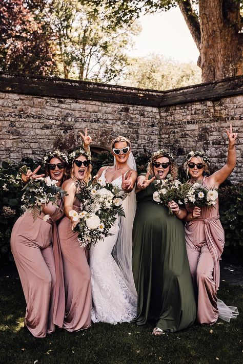 Bridal party in white heart shaped sunglasses, a lace wedding dress and pink and green bridesmaid dresses Bridesmaid Dresses Sage Green And Blush, Dark Green And Pink Bridesmaid Dresses, Pink Green Bridesmaid Dresses, Sage Green Dusty Blue Blush Pink Bridesmaid Dresses, Green And Blush Bridesmaid Dresses, Sage Green And Blush Pink Bridesmaid Dresses, Wedding Colors Pink And Green, Dusty Pink And Emerald Green Wedding, Sage And Pink Bridesmaid Dresses