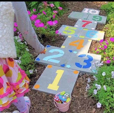 Diy Hopscotch Outdoor, Playground Accessories Diy, Outdoor Play Area Flooring Ideas, How To Paint Pavers, Backyard Sidewalk Ideas, Paver Hopscotch, Backyard Hopscotch, Hopscotch Pavers, Painted Pavers Ideas