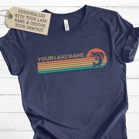 "Personalized lake t-shirt! This vintage-inspired retro sunset design can be fully customized with your lake name and a special lake-themed graphic that best represents your lake life. This shirt is perfect for a day out on the boat or a casual weekend at the cabin. A perfect gift for yourself or a loved one who loves the lake and sunsets.Always FREE SHIPPING within the United States! Available in 8 colors: white, dark grey heather, heather navy, natural, heather slate, army, heather peach and m Lake Life Shirt, Lake Names, Friends T Shirt, Sunset Design, Sunset Lake, Retro Sunset, Lake Sunset, Casual Weekend, The Cabin