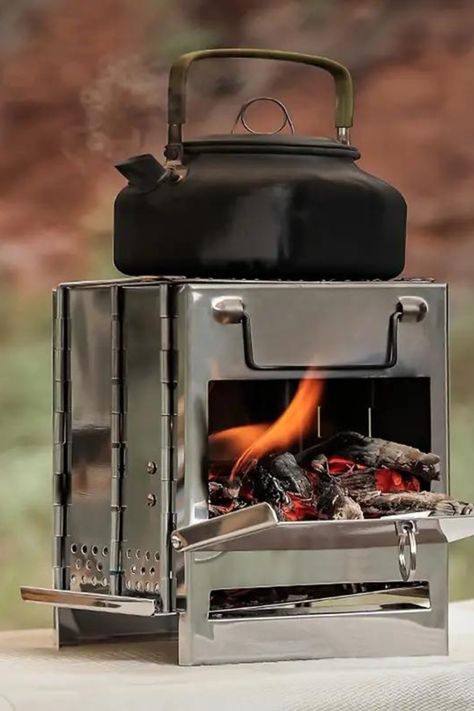 Stay cozy under the stars with our top small wood burning stoves, perfect for your next camping trip! Compact, efficient, and portable, these stoves are just what you need to heat up a night in the wilderness. Check out our favorites and get ready for a warm, adventure-filled season on our blog. #GoTinySpace #CampingStoves Rv Wood Stove, Portable Wood Stove, Wood Burning Camp Stove, Small Wood Burning Stove, Camping Wood Stove, Mini Stove, Cast Iron Stove, Wood Burning Stoves, Tray Design