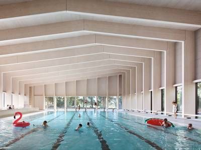 Swimming pool in London is built out of wooden portal frames and Cross Laminated Timber School Swimming Pool, Structural Engineer, Swimming Pool Architecture, Indoor Pools, Indoor Swimming Pool, British Architecture, Wood Architecture, Building A Pool, Timber Construction