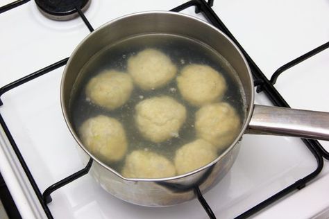 Boiling meatballs. To increase flavor, season the water prior to boiling. Bring a pot of water large enough to comfortably hold all meatballs to a rolling boil. Add any dried spices, herbs, seasonings or additional liquids to the water before bringing it to a boil. Carefully place the meatballs into the water and cover the pot, letting them boil until they are fully cooked with an internal temperature of 160 F. While a quick-read thermometer is the surest way of testing for doneness, cooked meat Boiled Meatballs, Gap Diet, Dried Spices, Baked Meatballs, Mini Meatballs, How To Make Meatballs, How To Cook Meatballs, Gaps Diet, Homemade Meatballs