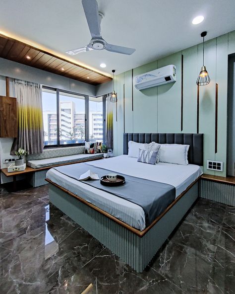 The Master bedroom becomes a space for the couple to unwind; the subtle hues of sea green and grey combined with walnut wood inlay grooves, along with design elements like (cozy) corner seating aid this idea. The Idea was to make the master-bedroom a space where the couple can unwind at the end of the day. Indian Bed Design, Bedroom Furniture Design Indian, Bedroom Inspirations Indian, Bed Design Indian, Indian Modern Bedroom Interior, Interior Design Bedroom Indian, Bedroom Design Indian, Indian Bedroom Ideas, Indian Style Bedroom