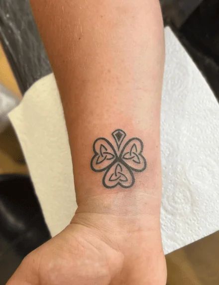 35+ Shamrock Tattoo Ideas To Bring You The Luck Of The Irish! Irish Symbol Tattoos, Irish Flower Tattoo, Small Irish Tattoos, Irish Shamrock Tattoo, Celtic Knot Meanings, Watermelon Tattoo, Shamrock Tattoo, Wrist Tattoo Cover Up, Shamrock Tattoos