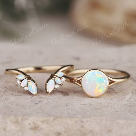 Unique Round Opal Engagement Ring Set Vintage Rainbow Opal Ring Art Deco Round Moissanite Diamond Gold Rings Opal Bridal Set Gift For Her ITEM DETAILS ●Available in yellow, white or rose solid 10k, 14k or 18k gold. This ring can be made in Platinum or sterling silver. ❀❀Center Stone: Natural opal Shape: Round shape Size: 6.5mm Band width: Around 1.5mm ❀❀Open wedding band Stones: Natural opal & Moissanite / Natural Diamond Shape: Marquise & Round shape Moissanite / Diamond Weight: About 0.01ct Cl Opal And Silver Engagement Ring, Opal And Moissanite Engagement Ring, Opal Engagement Ring Simple, Dainty Opal Wedding Ring, Matching Opal Wedding Rings, Pink Tourmaline And Opal Engagement Ring, Opal And Gold Ring, Bezel Opal Ring, Engagement Rings Gender Neutral