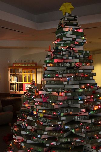 The  National Union Catalog Christmas tree is back @  Gleeson Library. Our 2009 edition was well received, so we set out to one-up our efforts from last year.   This year’s tree is over 9 feet tall, and has 2 spouts next to it. In the background of a few of the photos is our award winning Cable Car Book Cart. Books Christmas Tree, Bookish Christmas, Books Christmas, Book Christmas Tree, Book Page Wreath, Book Tree, Green Books, Bookish Gifts, Noel Christmas