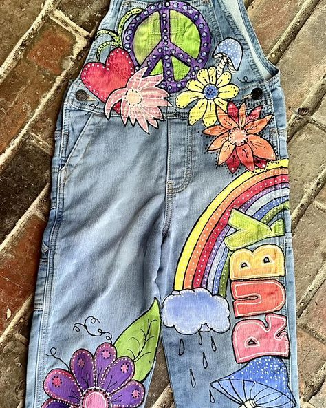 Been busy. I want to get all my orders finished before the 15th. Here is a new painted overalls design for a new customer in Rhode Island! #artistsofinstagram #painted #painted #overalls #paintedoveralls #painted #denim #painteddenim #painteddenimjeans #kids #kidsfashion #boutique #boutiqueshopping #boutiquestyle #boutiquefashion #boutiqueclothing #kidsboutique #kidsboutiqueclothing #kidsboutiques #kidsboutiqueuagirl #hippy #hippylife #hippystyle #hippychick #hippyvibes #hippyart #hippylove ... Painting On Denim, Custom Overalls, Flowers And Rainbows, Painted Overalls, Long Overalls, Toddler Birthday Party, Girls Overalls, Hippie Girl, Peace Signs