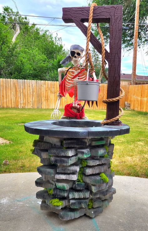 DIY Halloween wishing well that is made out of a rubbermaid trash can and polystyrene foam board insulation. The pieces of bricks are cut into various sizes and shapes. I used cans of great stuff spray foam to glue the bricks to the trash can. Halloween Well Prop, Diy Wishing Well Stage Prop, Pirate Ship Halloween Yard Diy, Halloween Toxic Waste Barrel, Pirate Ship Halloween Yard, Pirate Halloween Party, Halloween Wishes, Pirate Halloween, Creepy Halloween Decorations