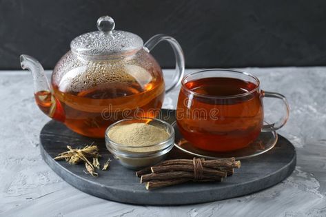 Aromatic licorice tea, dried sticks of licorice root and powder on light gray textured table royalty free stock photos Licorice Root Tea, Licorice Tea, Gray Table, Licorice Root, Divine Feminine, Licorice, Free Stock Photos, Light Gray, Borders