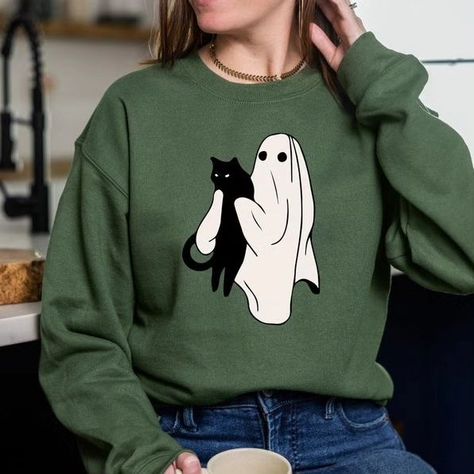 Ghost Black Cat Halloween Sweatshirt, Ghost Cat Halloween Hoodie, Halloween Gift for Cats Owner, Funny Halloween Sweatshirts,Halloween tees 👉Click to buy from Etsy Shop :🛒 https://www.etsy.com/listing/1534563152/ghost-black-cat-halloween-sweatshirt 📌Store Link in Bio Welcome to Turquoisefashionus! Its great to see you here! We prioritize one thing here and that is quality and customer satisfaction. Our hoodies and sweatshirts are super comfortable and the quality is very good. Unique... Holding A Cat, Turquoise Fashion, Ghost Cat, Halloween Hoodie, Cat Halloween, Sister Shirts, Mom And Sister, Black Cat Halloween, Halloween Tees