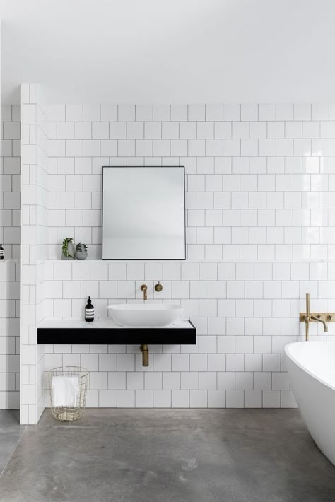 Bathroom with bright white subway tile walls and dark concrete floor Interior Design Minimalist, Concrete Bathroom, Scandinavian Bathroom, Bad Inspiration, White Subway Tile, Basement Bathroom, Bathroom Floor Tiles, Minimalist Bathroom, Bathroom Renos