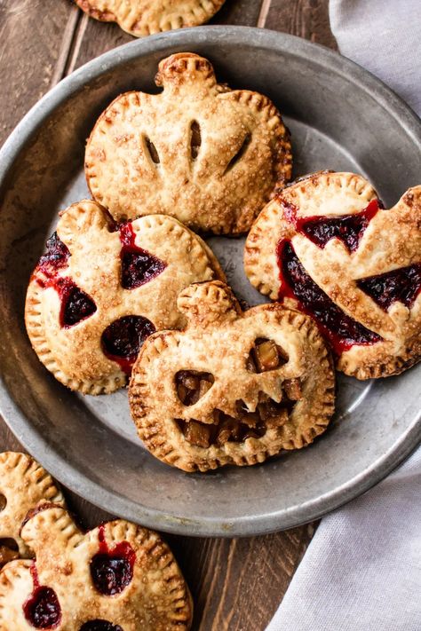 easy halloween jack-o-lantern hand pies - SO MUCH FOOD So Much Food, Dessert Halloween, Pie Dough Recipe, Pumpkin Cutouts, Spooky Snacks, Hand Pie Recipes, Hand Pie, How To Make Pie, Halloween Baking