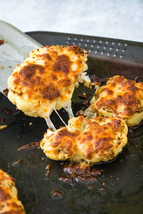 Crispy, golden, and irresistibly cheesy—these Cauliflower Steaks are a veggie lover's dream! Perfectly roasted and topped with melted cheese, they make a delicious side dish or a satisfying meatless main. Easy to make and even easier to devour—pin this recipe for your next healthy comfort food craving! Cheesy Cauliflower Steaks, Cauliflower Slices, Slow Cooker Salmon, Cauliflower Steaks Recipes, Cheesy Cauliflower, Cauliflower Steaks, Healthy Comfort, Best Vegetarian Recipes, Vegetarian Recipe