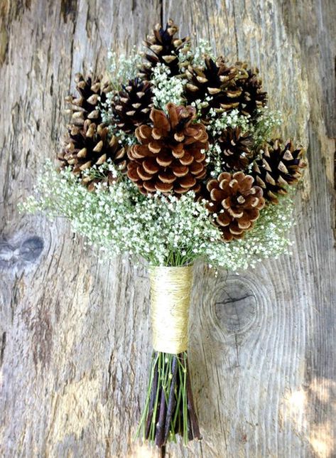 If you want to get really creative, you could skip the roses and mums entirely and go for a pine cone bouquet. Surround pine cones with sprays of baby’s breath to match your white wedding dress. | Pine Cone Bouquet | Seasonal Favorites: 5 Winter Wedding Bouquets Winter Bridal Bouquets, Unique Wedding Bouquet, Elegant Winter Wedding, Rustic Winter Wedding, Winter Wedding Bouquet, Winter Wedding Decorations, Winter Wedding Flowers, Winter Wedding Inspiration, Winter Wonderland Wedding